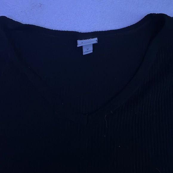 This is a compfy top from target. 71% Rayon, 21% Polyester, and 4% Spandex. - Picture 3 of 3